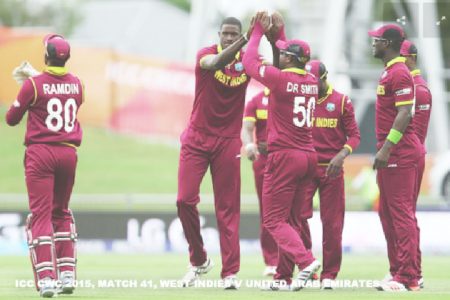 West Indies skipper Jason Holder (second from left) was voted the man of the match as the West Indies qualified for the quarter-finals of the 2015 World Cup after defeating the United Arab Emirates (UAE) yesterday. (Photo courtesy of CWC website)