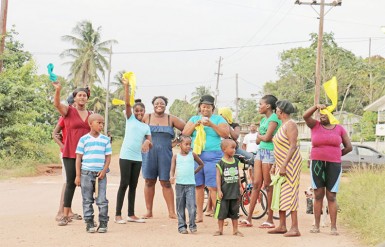 Linden residents indicating their support for the opposition alliance on Saturday.  