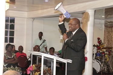 Nigel Hughes raising the bull horn at the funeral service.   