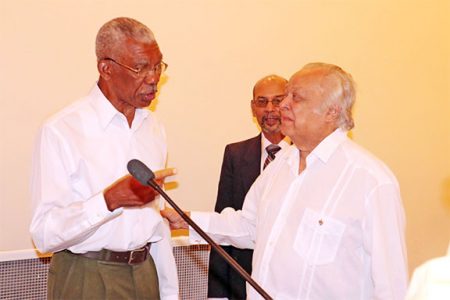Presidential candidate David Granger (left) shares a moment with Sir Shridath Ramphal during Tuesday’s forum at the Pegasus Hotel.
