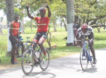 Team Coco’s Hamza Eastman celebrating before crossing the finish line yesterday ahead of Orville Hinds. 