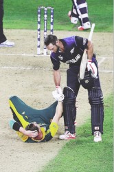 HELPING HAND! New Zealand’s Grant Elliott lends a helping hand to South Africa’s pace bowler Dale Steyn before hitting the penultimate delivery of Steyn’s final over for six to send New Zealand through to their first World Cup final. 