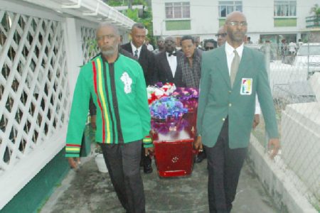 Charles Corbin, left and Garfield Wiltshire, right, lead the pallbearers delivering Shanomae Blackmore to her final resting place yesterday.