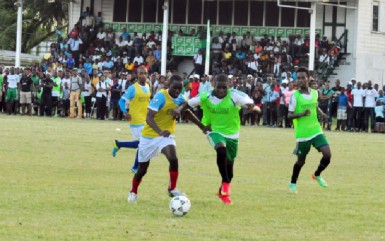 Morgan Learning Centre’s Wayne Murray (left) and Chase Academy’s Jeremy Garrett tussling for possession of a loose ball during their team’s semi-final fixture at the Ministry of Education ground 