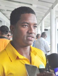  Leon Johnson speaks with reporters on landing at the CJIA after the Guyana Jaguars won the Regional 4-day title  