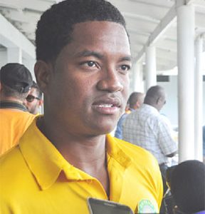  Leon Johnson speaks with reporters on landing at the CJIA after the Guyana Jaguars won the Regional 4-day title