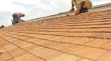 Shingles by Bulkan Timber works being installed on a roof 