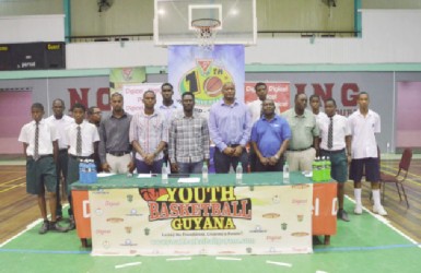 Members of the Youth Basketball Guyana (YBG) National Schools Championships launch committee alongside representatives of the Beharry Group of Companies, GABF, Banks DIH Limited and Digicel pose for a photo opportunity following the launch of the tourney yesterday.