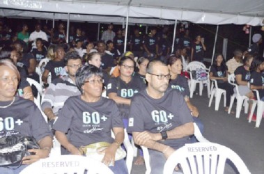 Minister of Natural Resources and the Environment Robert Persaud (right in front row) among the gathering at the WWF and other partners’, Earth Hour 2015 observance at the National Park (GINA photo)