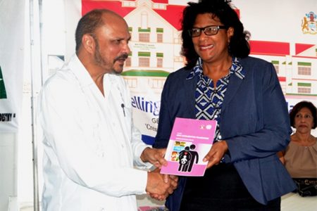Minister of Health Dr. Bheri Ramsaran presenting People’s Progressive Party Civic (PPP/C) Prime Ministerial Candidate Elisabeth Harper with a copy of Guyana’s MDG acceleration Framework (maternal health). The occasion was Friday’s sod-turning ceremony at the Georgetown Public Hospital for a remodelled and extended maternity ward. (GINA photo)