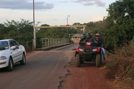 Members of the Community Policing Group ride the lone vehicle –an ATV – available to the police at Lethem. 
