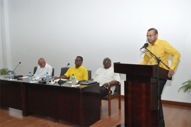 Natural Resources Minister Robert Persaud addressing the miners. President Donald Ramotar is sitting at left. (GINA photo)