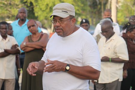 Social activist Barrington Braithwaite speaking to those gathered at Parade Ground yesterday in solidarity with slain political activist Courtney Crum-Ewing.
