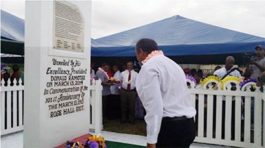 Minister of  Culture Youth and Sport Dr Frank Anthony lays a wreath at the Rosehall Martyrs' monument site (GINA photo)
