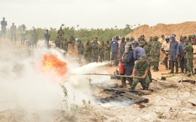 Members of the Joint Services demonstrating their firefighting skills during internal security training at the Inter-Services Institute of Internal Security Studies. A statement released by the army stated that the training is geared toward the middle and lower ranks of the services and is meant to exercise the “junior command element” in managing different internal security situations. “The training is timely in wake of Guyana’s preparation for the 2015 general and regional elections,” it added. (Guyana Defence Force photo) 