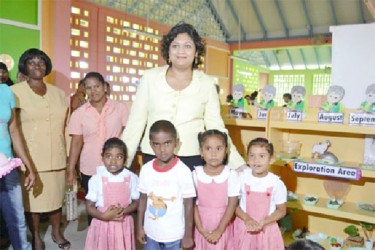 Minister of Education, Priya Manickchand with students of the newly commissioned school (GINA photo) 