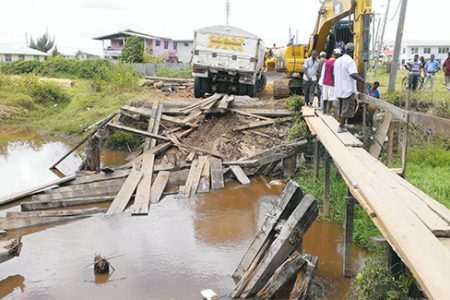  The truck that destroyed the Eastville Housing Scheme bridge was removed yesterday, while work was ongoing to build a pedestrian walkway for residents. 