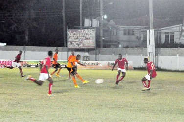 Anthony Abrams (centre) of Slingerz FC attempting a 24-yard right-footed attempt from outside the centre of the penalty box during his side’s easy semi-final win over Riddim Squad  