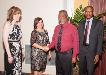 From left are Scotiabank Senior Vice-President Caribbean South, Anya Schnoor; outgoing Country Manager Amanda St. Aubyn, Prime Minister Samuel Hinds and new Guyana Country Manager Raymond Smith. (Scotiabank photo) 