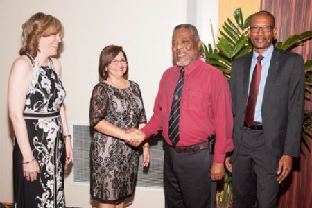 From left are Scotiabank Senior Vice-President Caribbean South, Anya Schnoor; outgoing Country Manager Amanda St. Aubyn, Prime Minister Samuel Hinds and new Guyana Country Manager Raymond Smith. (Scotiabank photo)