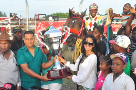 Handlers of CP Got Even accepting the winner’s trophy for yesterday’s feature A and Lower Event. (Orlando Charles photo)