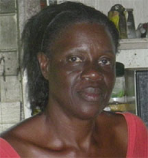 Bernadette Hinds standing in her home