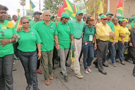 APNU+AFC presidential candidate David Granger (centre) leading his team yesterday.
