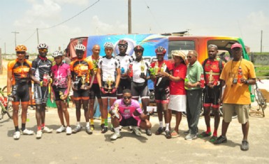 Prize winners of yesterday’s Powerade 50-mile road race pose with their spoils. (Orlando Charles photo)