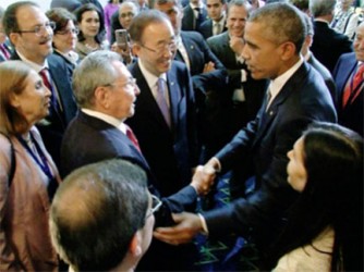 Presidents Obama and Castro shake hands at the Panama summit yesterday (Photo: NPR News)