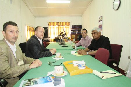 Chairman of the Guyana Elections Commission Dr Steve Surujbally (right) and Public Relations Officer Richard Francois (second, right) during a meeting with Carter Center’s Assistant Director, Global Development Jason Calder (left) and Operations Manager Pedro Teixeira (second, left)
