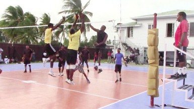 Most Valuable Player Adityanand Singh (right) attempts to spike the ball past the block set up by Levi Nedd and Klondyke Rodney in the final. 