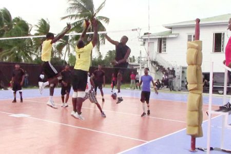 Most Valuable Player Adityanand Singh (right) attempts to spike the ball past the block set up by Levi Nedd and Klondyke Rodney in the final.
