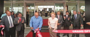 President Donald Ramotar (third from left) and Brenda Durham, Senior Vice President and Regional General Counsel for Marriott International cutting the ribbon to declare the hotel open. (Arian Browne photo) 