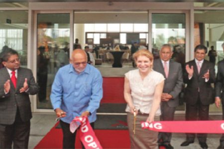 President Donald Ramotar (third from left) and Brenda Durham, Senior Vice President and Regional General Counsel for Marriott International cutting the ribbon to declare the hotel open. (Arian Browne photo)
