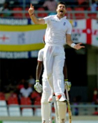 RECORD BREAKER! Jimmy Anderson leaps in delight taking the wicket of Denesh Ramdin to break England’s Test bowling record for most wickets on the final day of the first Test between West Indies and England yesterday at the Vivian Richards Cricket Ground. Photo by WICB Media/Randy Brooks of Brooks Latouche Photography 