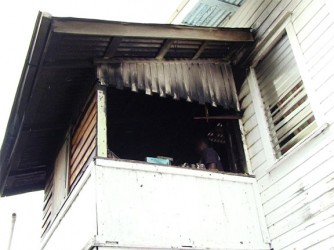The badly scorched bedroom aback of the house