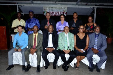 Recipients of the awards along with IOC Member, Sir Austin Sealey and the top brass of the GOA pose for a photo following the Appreciation and Award Ceremony at the Georgetown Club on Saturday evening. 