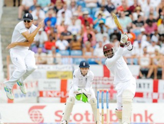 Alistair Cook leaps out of the way of a Marlon Samuels drive on the first day of the second Test between West Indies and England yesterday at the National Cricket Stadium. Photo by WICB Media/Randy Brooks of Brooks Latouche Photography 