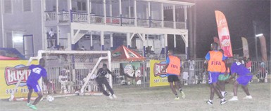 Sparta Boss’s Sheldon Shepherd (left) in the process of unleashing a shot on the Alexander Village goal after receiving a right-sided pass during his side’s narrow victory.