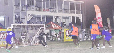 Sparta Boss’s Sheldon Shepherd (left) in the process of unleashing a shot on the Alexander Village goal after receiving a right-sided pass during his side’s narrow victory.