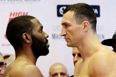 Reigning heavyweight champion Wladimir Klitschko (R) of Ukraine and U.S. boxer Bryant Jennings face each other during an official weigh-in ahead of their fight in New York  yesterday. REUTERS/EDUARDO MUNOZ   
