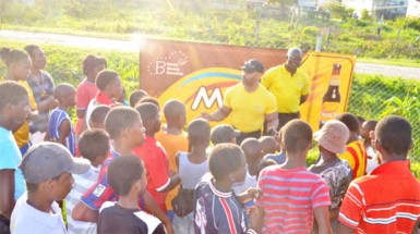 Hugh Ross and Clayton McKenzie interact with youths of Agricola during the Outreach Exercise