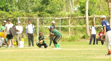 One of the students of Berbice High School swinging for the fences during the practical baseball exam yesterday.