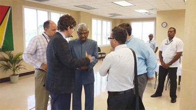 Chairman of Gecom Dr Steve Surujbally (centre) converses with Carter Center Field Office Director Jason Calder, British High Commissioner to Guyana Greg Quinn and US Charge d’Affaires Bryan Hunt. 