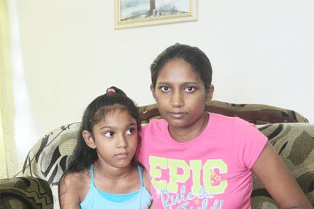 Teresa Lalltoo and her eight-year-old daughter Anuja
