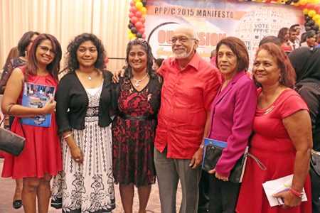 Former First Lady Varshnie Singh (second left), President Donald Ramotar (fourth left) and First Lady Deolatchmee Ramotar (second right) following the launch of the PPP/C manifesto yesterday. 