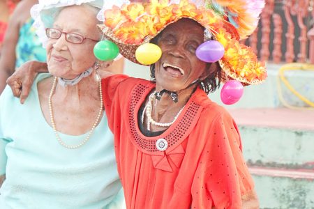 Sheila King (left) and Cecile Harding, both fixtures at the Inner Wheel Club of Georgetown’s annual Hat Show and Garden Party did not disappoint with their creations for this year’s event on Saturday. (Photo by Arian Browne)