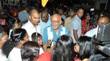 President Donald Ramotar interacting with residents of Herstelling, East Bank Demerara (GINA photo)