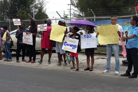 Some of the protesters yesterday in front of the Ministry of Health in support of Sherlina Nageer who was verbally abused by Health Minister Dr Bheri Ramsaran on Monday.  