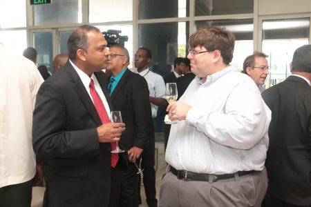 Chargé d’ Affaires of the US Embassy Bryan Hunt (right) chatting with Minister of Culture, Dr Frank Anthony at the opening of the Marriott Hotel this morning.